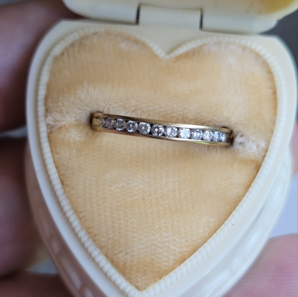 10k diamond band ring size 6 1/4. Stamped 10k. Genuine diamonds. Resizeable by a